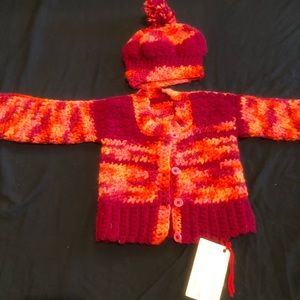Little girl’s matching sweater with hat set